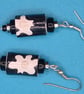 Black paper beaded earrings with white flower patterns - Image 2