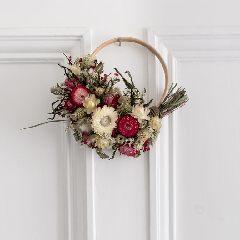 Small handmade pink and white dried flower wreath floral arrangement