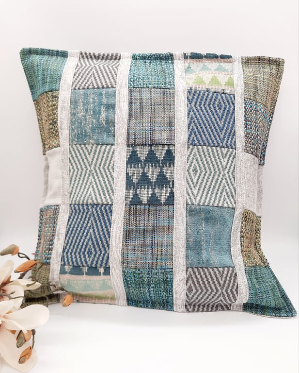 Patchwork cushion cover with a green theme.  