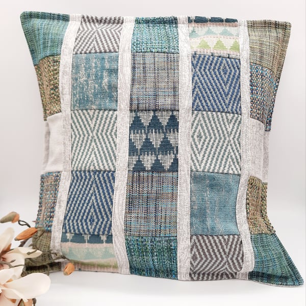 Patchwork cushion cover with a green theme.  