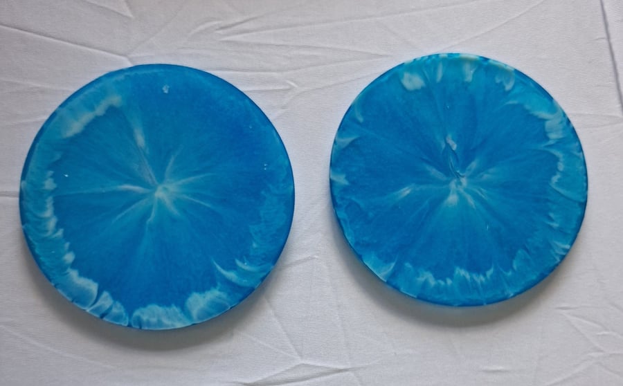 Set of two handmade epoxy resin round coasters. Blue