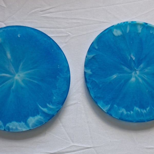 Set of two handmade epoxy resin round coasters. Blue