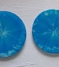 Set of two handmade epoxy resin round coasters. Blue