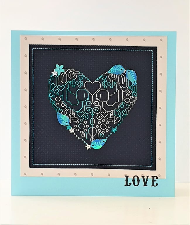 Heart cross stitch card with sequin embellishments and the wording 'Love'