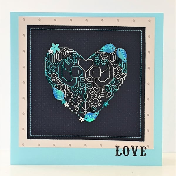 Heart cross stitch card with sequin embellishments and the wording 'Love'