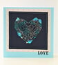 Heart cross stitch card with sequin embellishments and the wording 'Love'