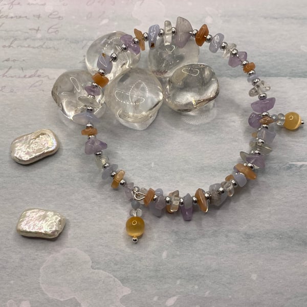 Memory wire bangle with peach moonstone, quartz, amethyst and selenite 