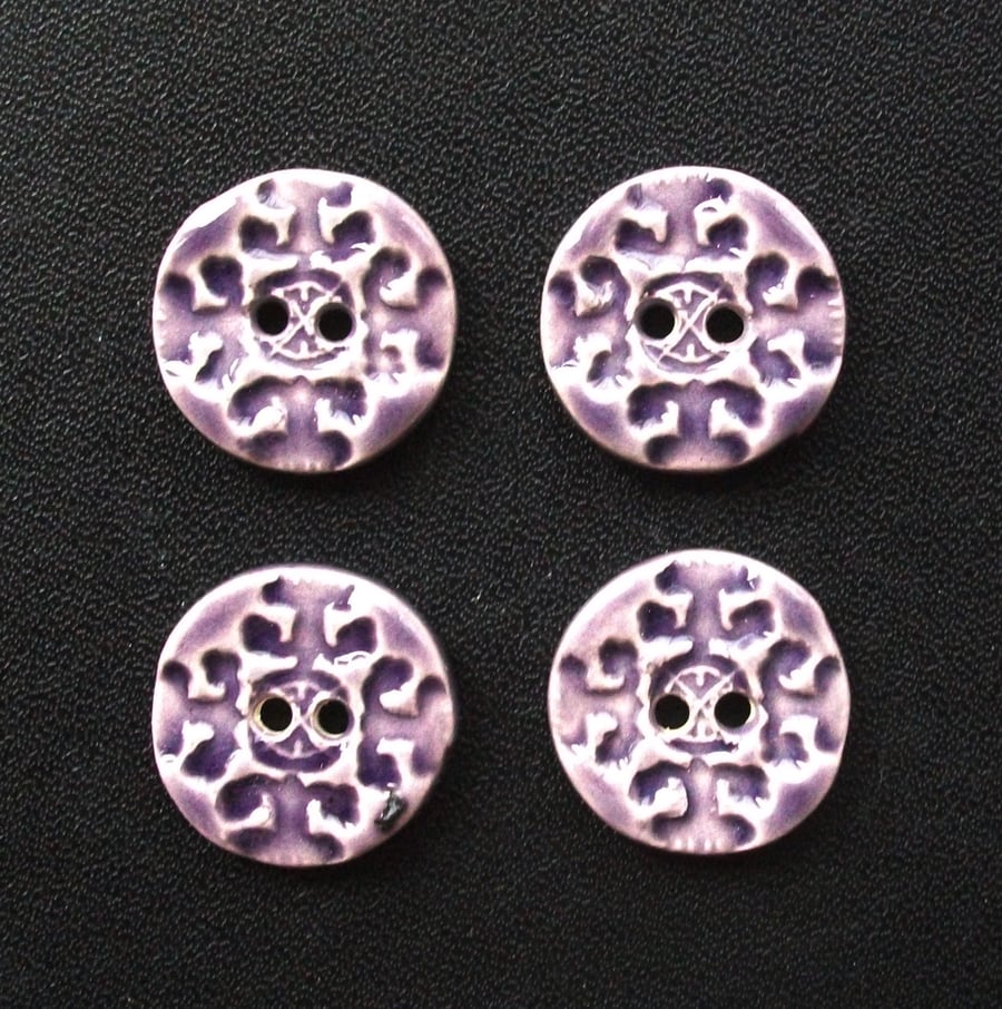 Set of four little handmade ceramic buttons