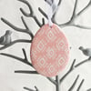 Pink Pottery Easter Egg decoration with white pattern