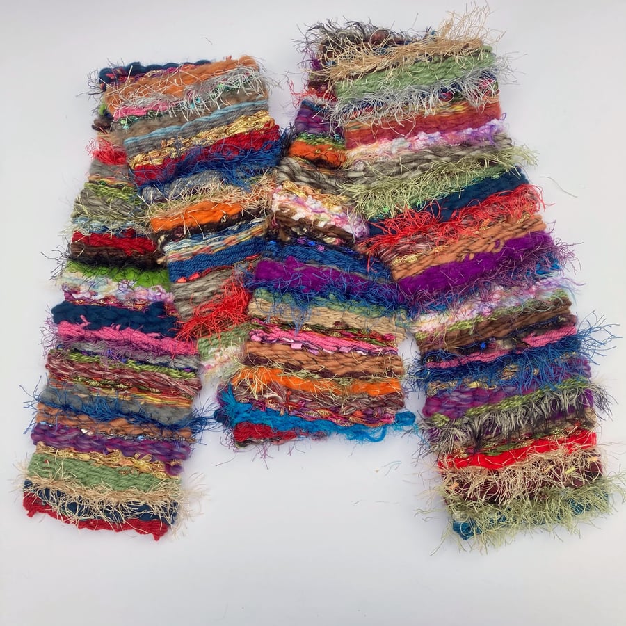 Skinny, multicoloured and multi textured peg woven scarf