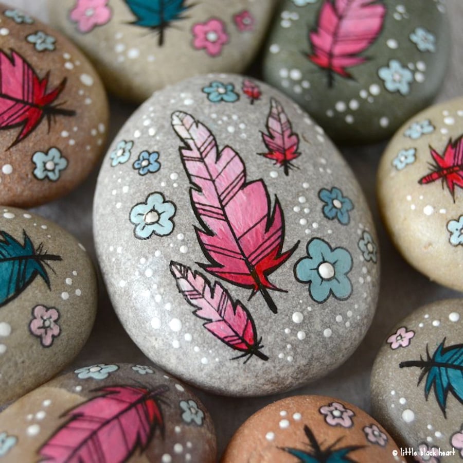 painted pebble - pink feathers and flowers