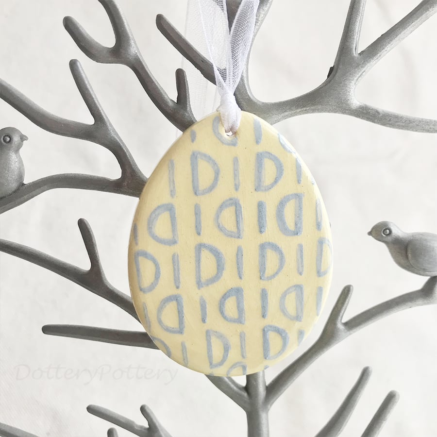 Sale Yellow Pottery Easter Egg decoration with blue pattern  