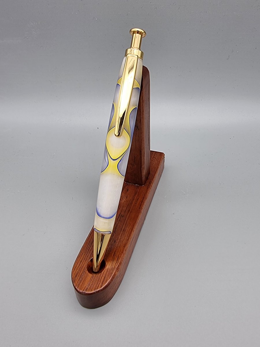 Pen with click mechanism in acrylic yellow white