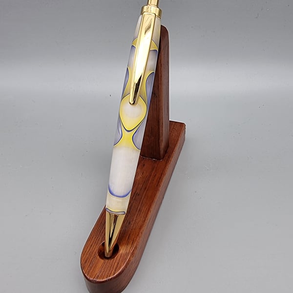 Pen with click mechanism in acrylic yellow white