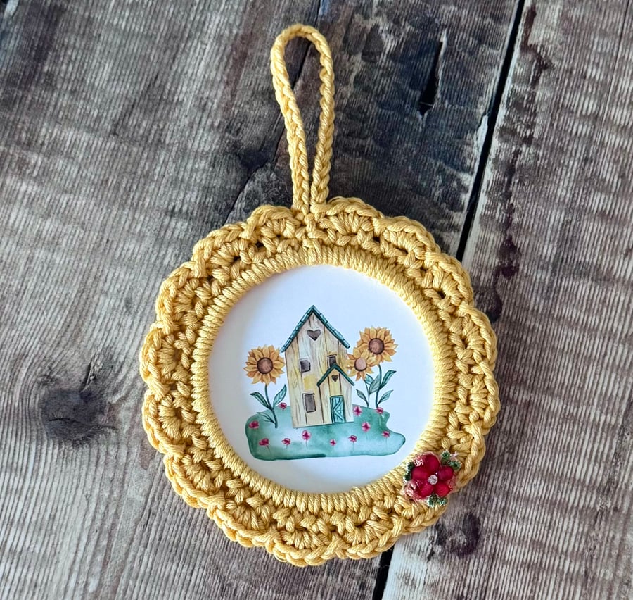 Hand crocheted frame with little cute house
