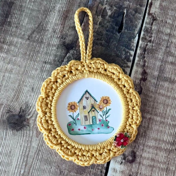 Hand crocheted frame with little cute house
