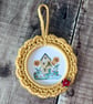 Hand crocheted frame with little cute house