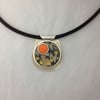 Orange circle double bezel pendant