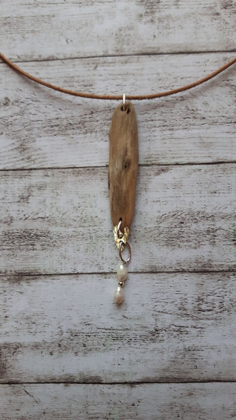 Driftwood and sterling silver pendant.