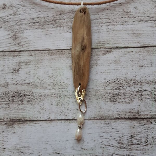 Driftwood and sterling silver pendant.