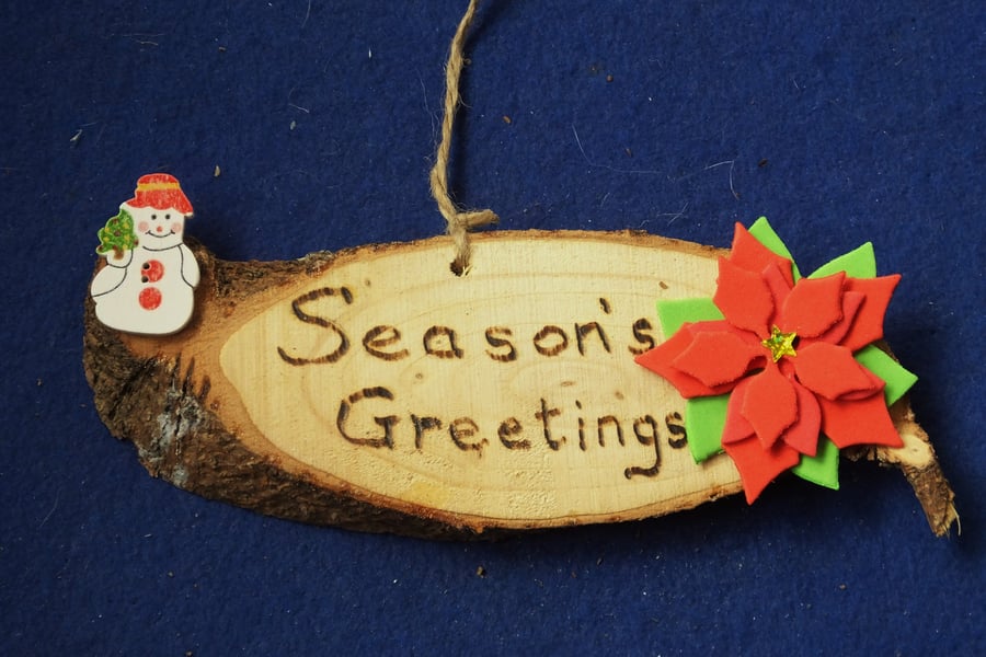 Season's greetings natural wooden sign for Christmas time