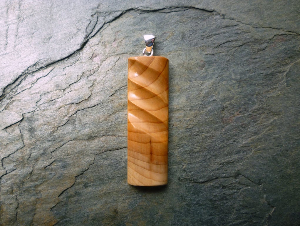 Carved Yew Wood Pendant, silver bail