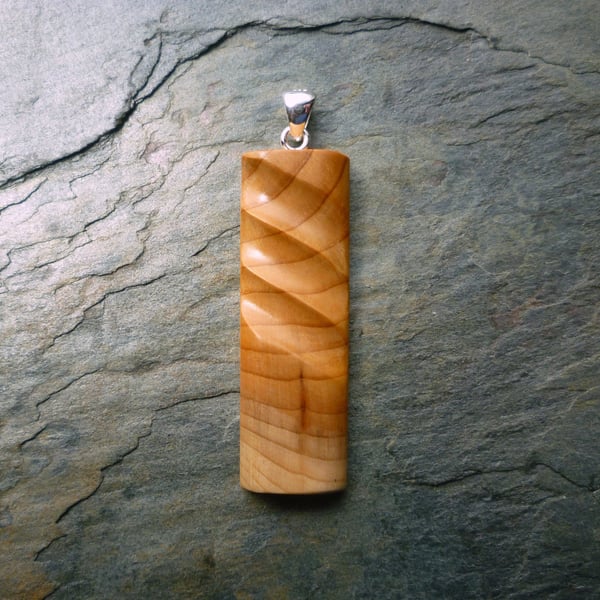 Carved Yew Wood Pendant, silver bail
