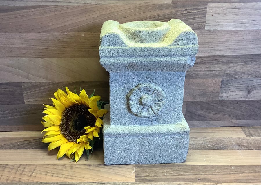 Replica of Roman Altar carved from stone with flower