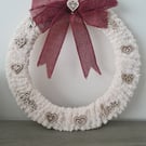 Chunky cream yarn wrapped wreath with rustic heart detail