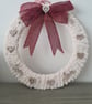 Chunky cream yarn wrapped wreath with rustic heart detail