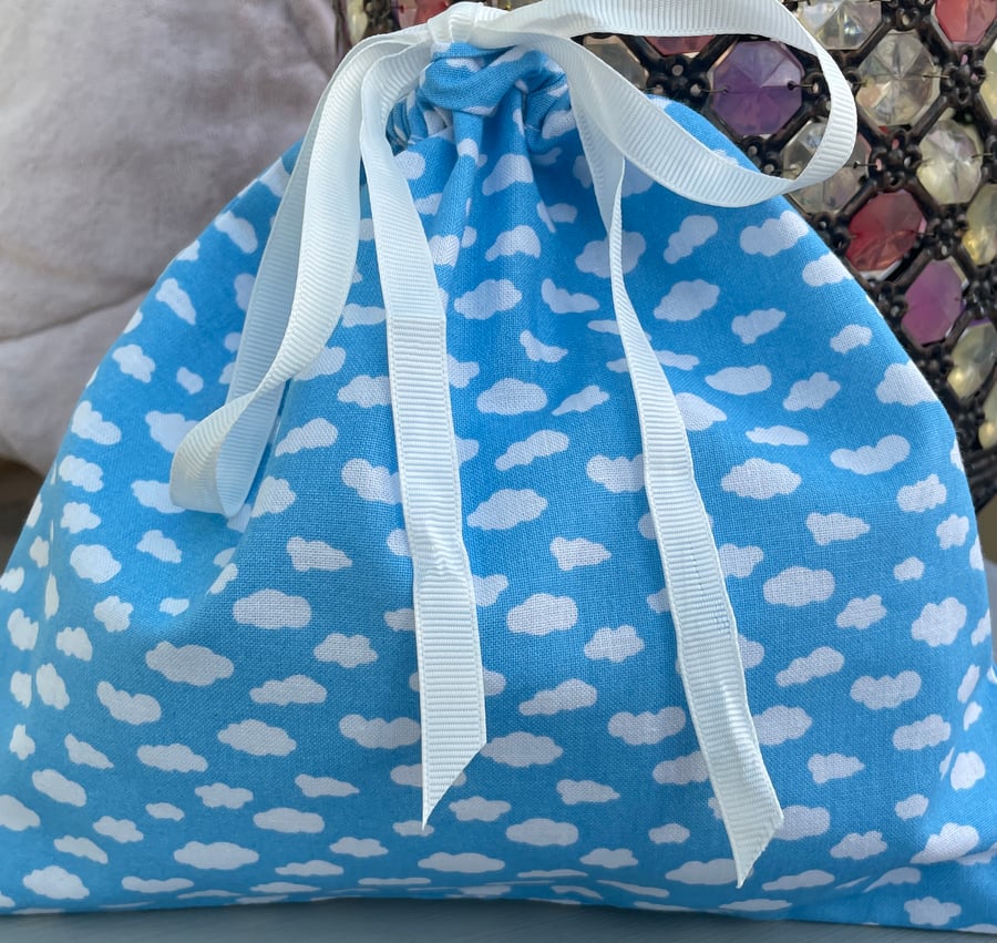 Fluffy clouds on a blue sky small cloth gift or storage bag