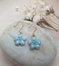 Handmade 18k gold plated floral earrings with light blue enameled flower charms 