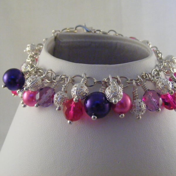 Silver Fuchsia and Purple Charm Bracelet.
