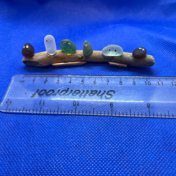 Sea glass 'nuggets' on driftwood.
