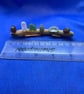 Sea glass nuggets on driftwood.