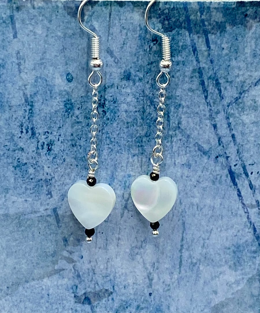 Mother of pearl heart drop earrings with tiny black faceted spinel stones