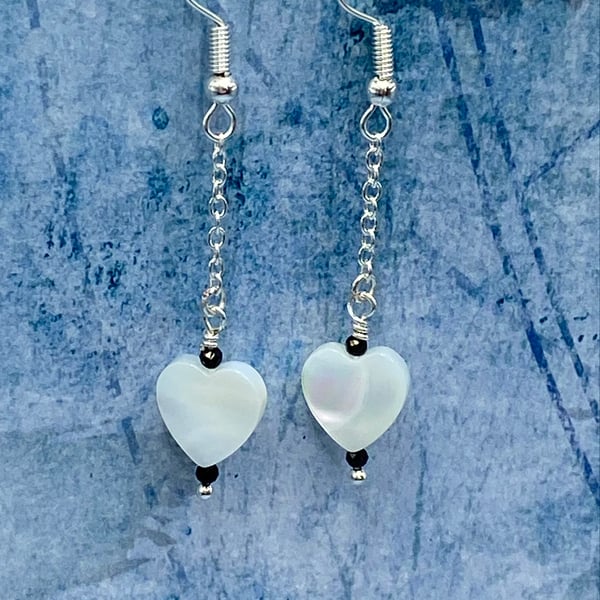 Mother of pearl heart drop earrings with tiny black faceted spinel stones