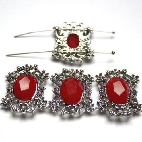 Connector with red cabochon