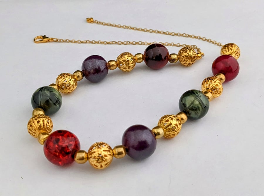 Red, purple, gold and green bead necklace - 1002696