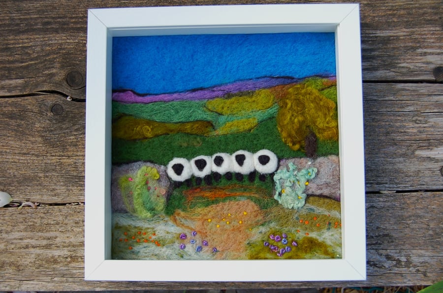 Sheep by a dry stonewall wool painting.  Needlefelt picture with hand embroidery