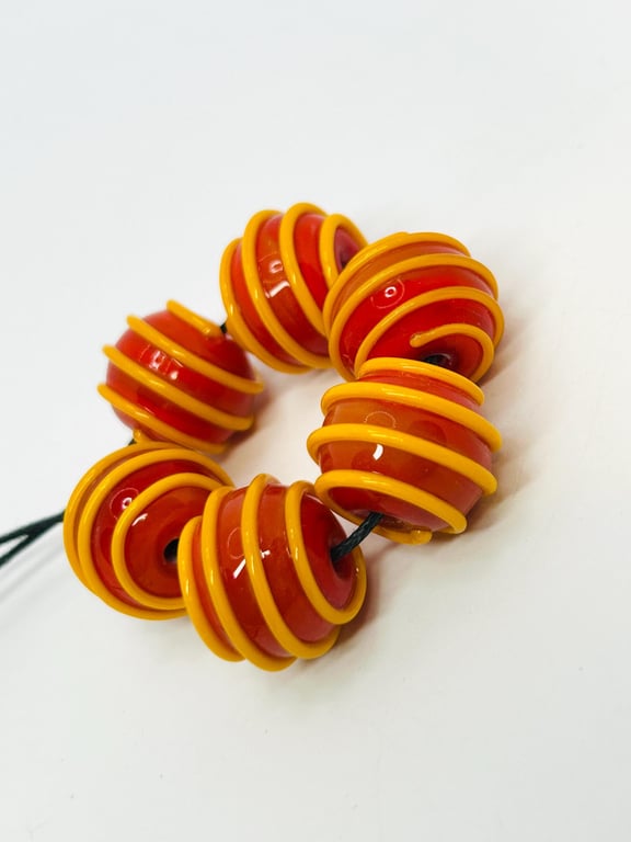 Handmade dark orange and yellow striped lamp work glass beads