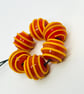 Handmade dark orange and yellow striped lamp work glass beads - Image 1