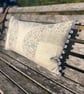 Long linen feature cushion with pompom trim