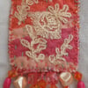 Orange and hot-pink textile art brooch 