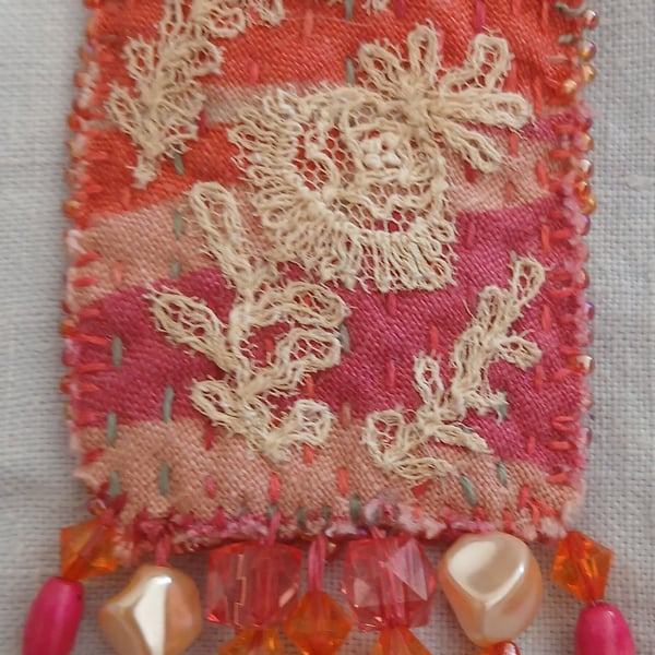 Orange and hot-pink textile art brooch 