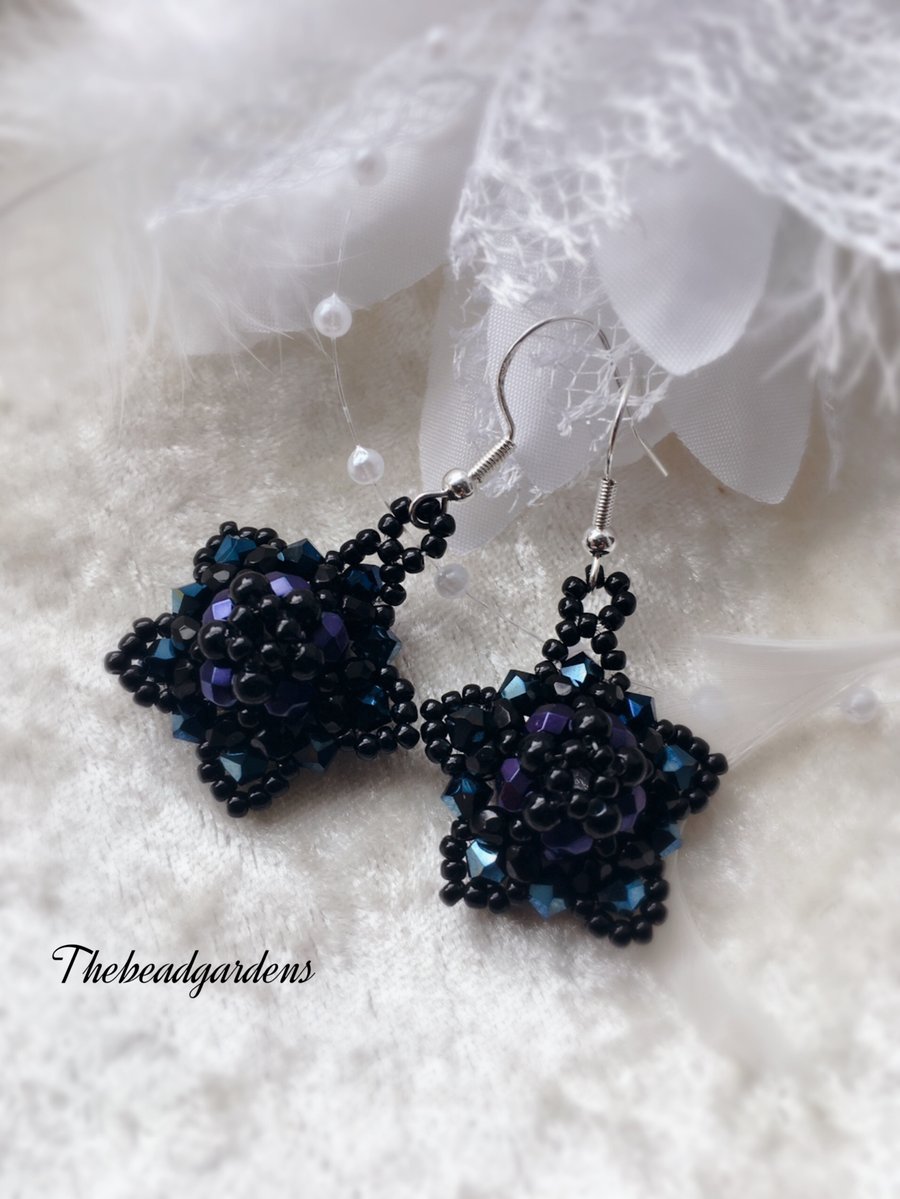 Black and blue star earrings 