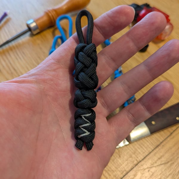 Black Gaucho knot into Diamond knot into stitched snakes knots.