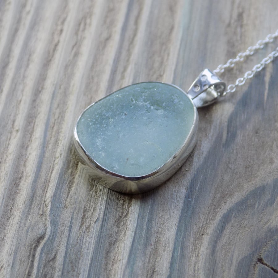 Sea glass and sterling silver bezel set pendant
