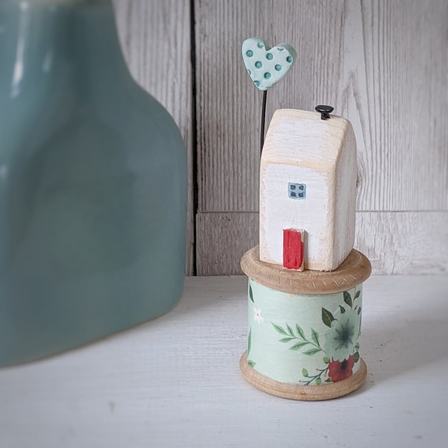 Wooden House on a Vintage Floral Bobbin with Clay Heart 