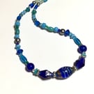 Recycled, remade and reloved blue and turquoise coloured glass bead necklace